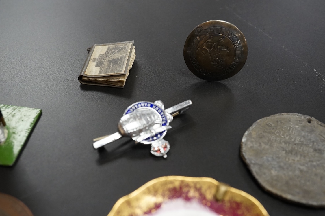 Objects of vertu and medals, including two Paris porcelain painted brooches, a leather cased almanac for 1827 and a painted ‘I Love You’ metal patch box